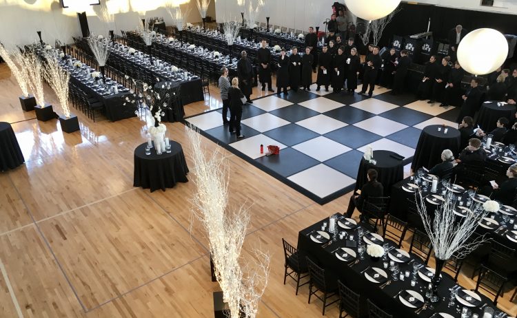 Black and white chairs, tables, balloons and floor