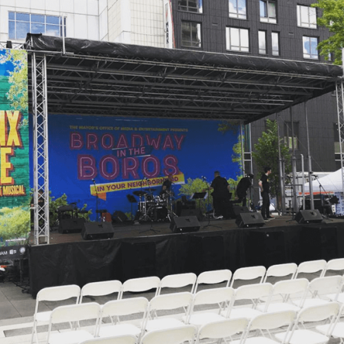 Broadway Boros and Crossfire Events Stage and white seats